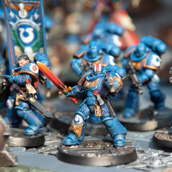 A collection of fully assembled and painted Houston Warhammer Space Marines figures, ready to do battle.