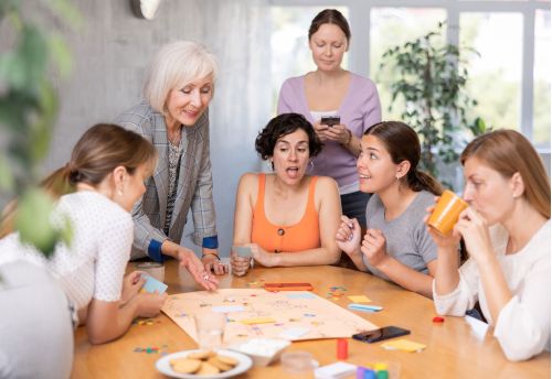 Texas Tabletop Games Group of Friends Playing Board Game on Table
