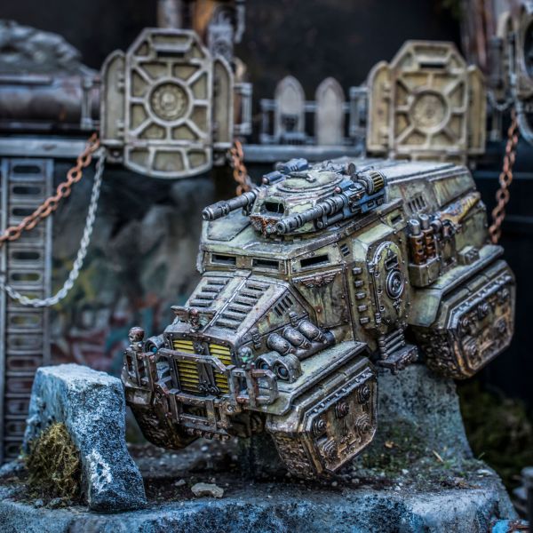 A Taurox armored transport vehicle of the Astra Militarum or Imperial Guard faction from Warhammer 40,000, just one of the many vehicle kits available for players to build and paint.